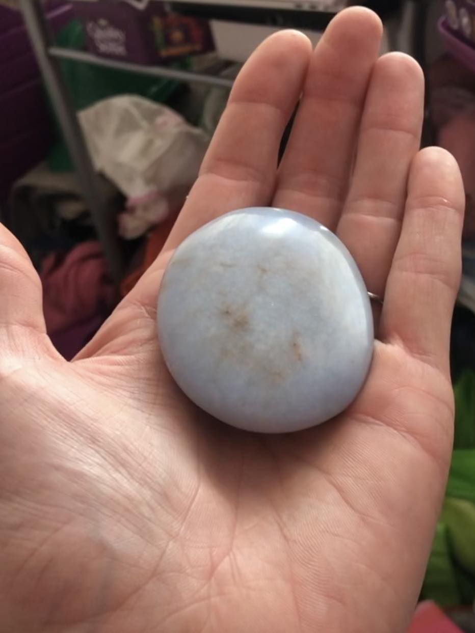 Kabutroid holding a rounded, flat, light blue stone in her hand. It's nicely palm sized, and should fit well in the head of the staff to be visible through all of the openings.