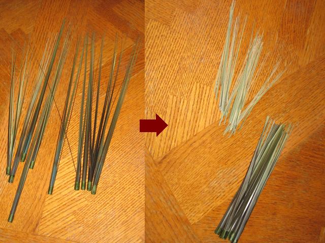 Little sprickles of fake grass laying in piles on a wooden table.
