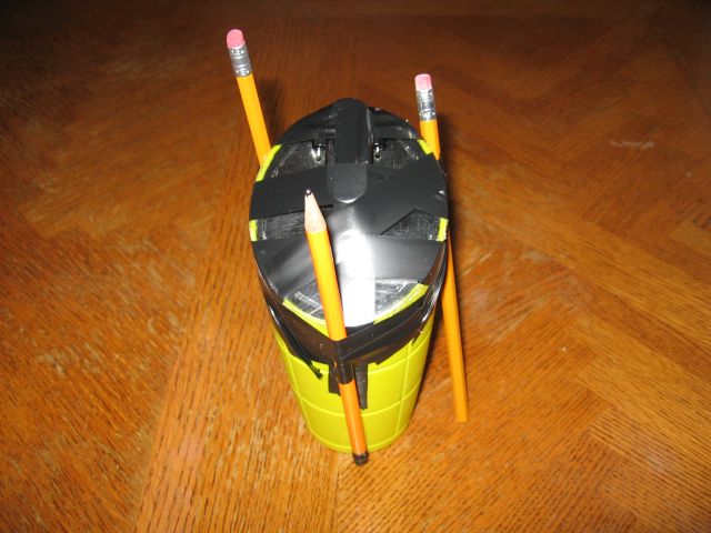 The lid taped in place to dry with pencils and electrical tape.