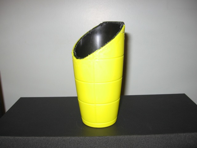 Ghe cup with the top cut off at an angle.