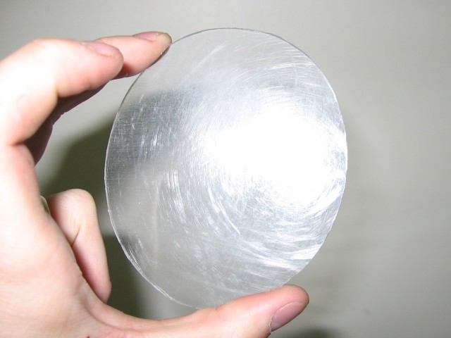 Kabutroid holding an oval of the acrylic.