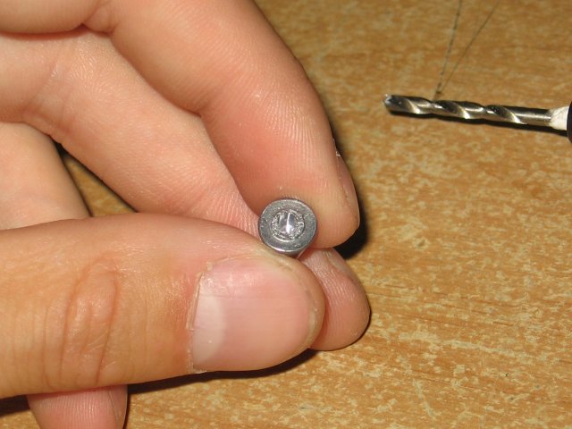 Showing a small hole in the center of the handle.