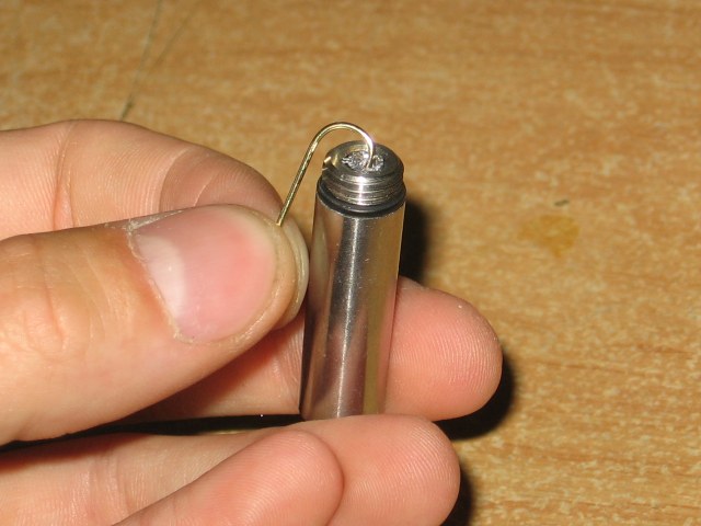 Showing using a wire to scratch up the inside of the hole