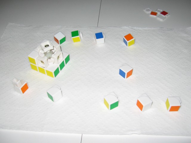 The cube half-assembled again, on top of the paper towel.
