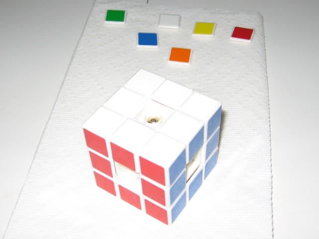 The cube fully assembled, with only the middle caps sitting to the side.