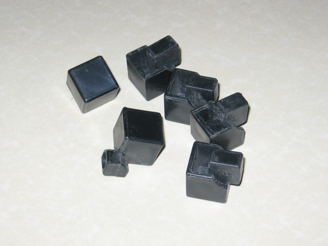 The handful of pieces, on the shiny countertop.