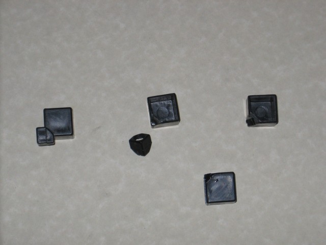 Three corners with the inner nub missing, one still attached, and the corner gap generally filled in.