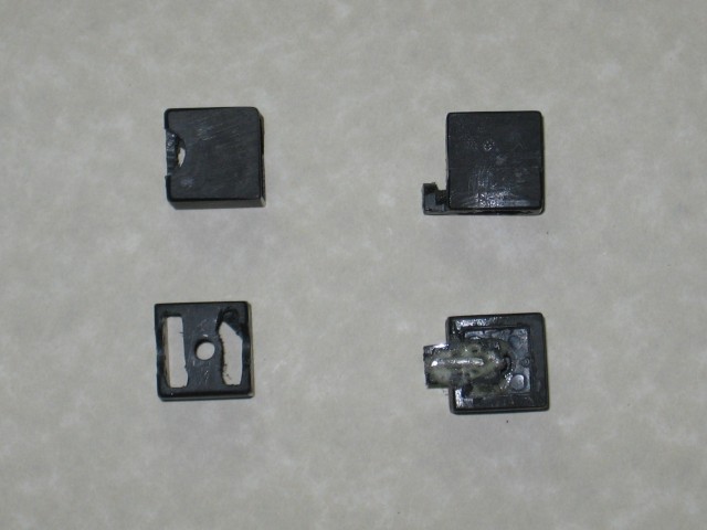 Grooves cut into two pieces, and plastic nubs coming out of the sides of two others.