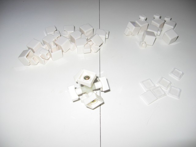 The middle of the cube assembled, standing upright on the table.