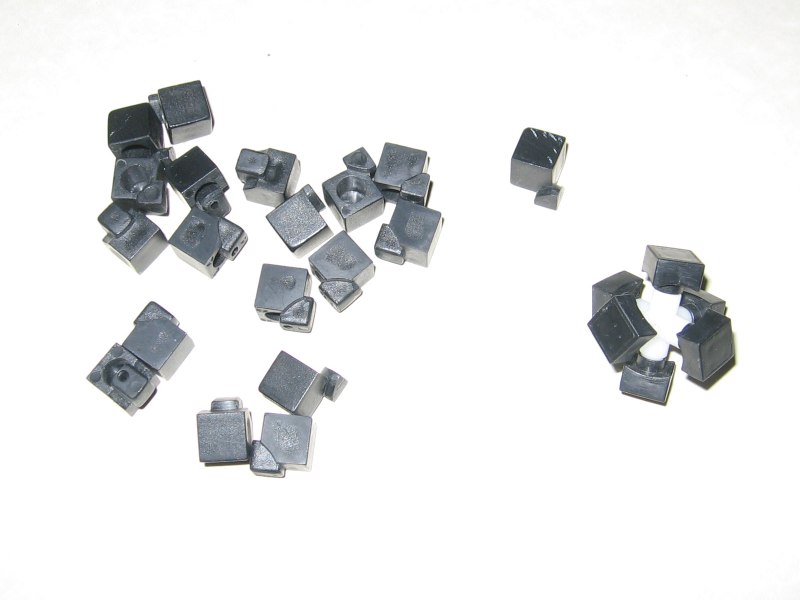 All of the cubies disassembled, with the core to the side.