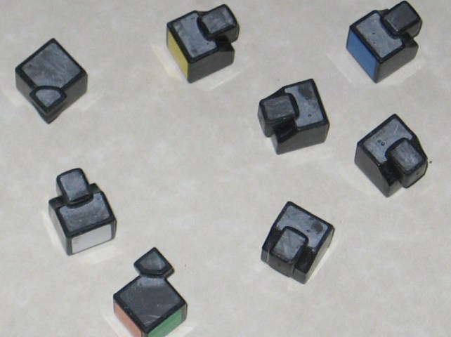 A handful of the pieces, with the plastic epoxy filled sides sanded down and flat.