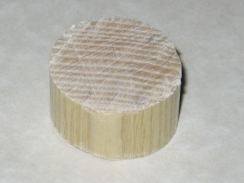 A little disk from the handle, sitting on the countertop.