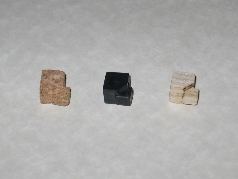 Three pieces shown, the cork one on the left, the regular one in the middle, and the wooden one on the right.