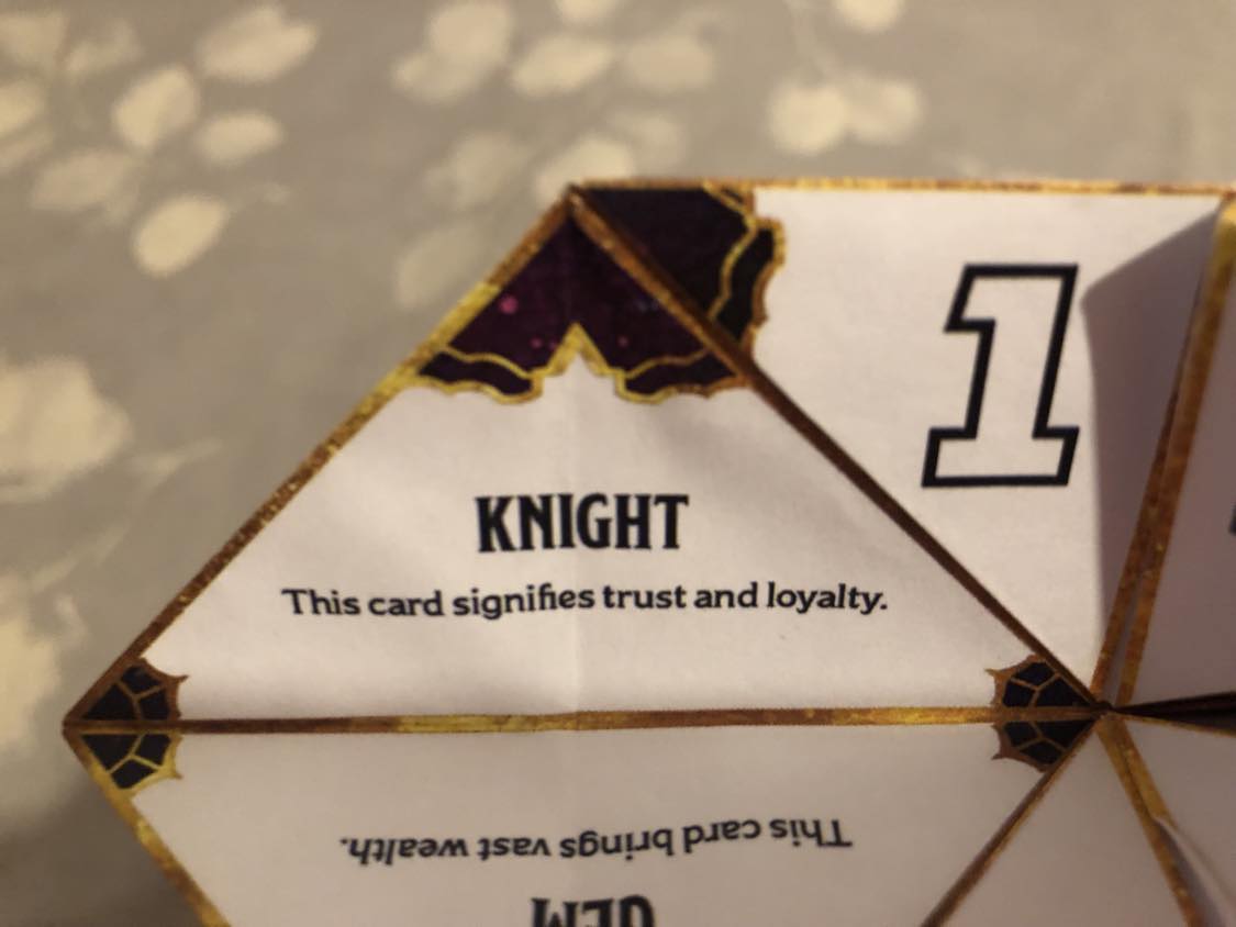 The fortune teller open to your fortune. 8, Knight. This card signifies trust and loyalty.